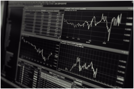 computer monitor showing graphs